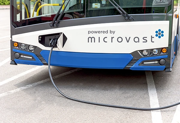 E-bus charging with Powered by Microvast logo on it